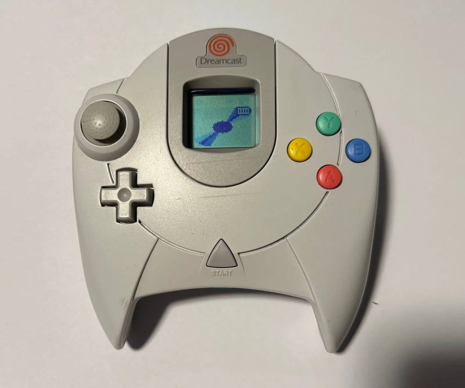 Dreamcast controller fitted with Pulsar and a VMU showing the Pulsar animation