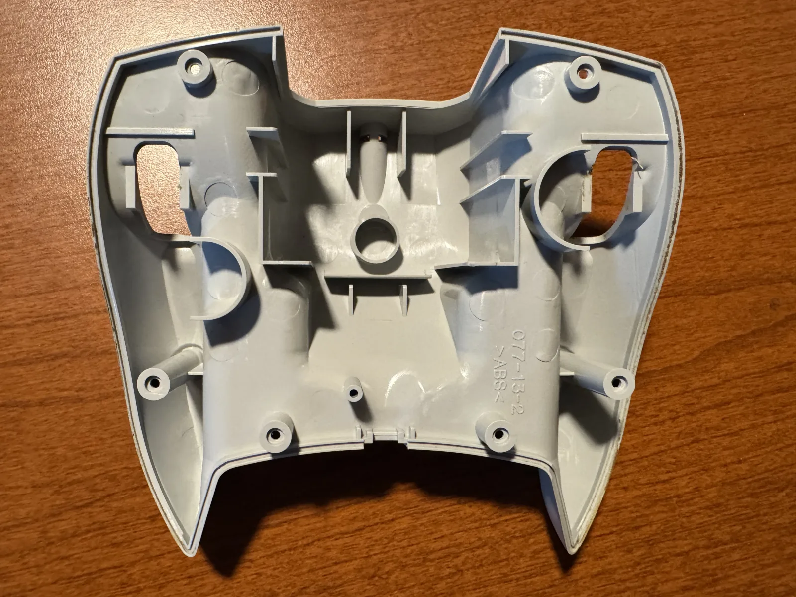 Inside of the controller back shell before the cable guard is removed