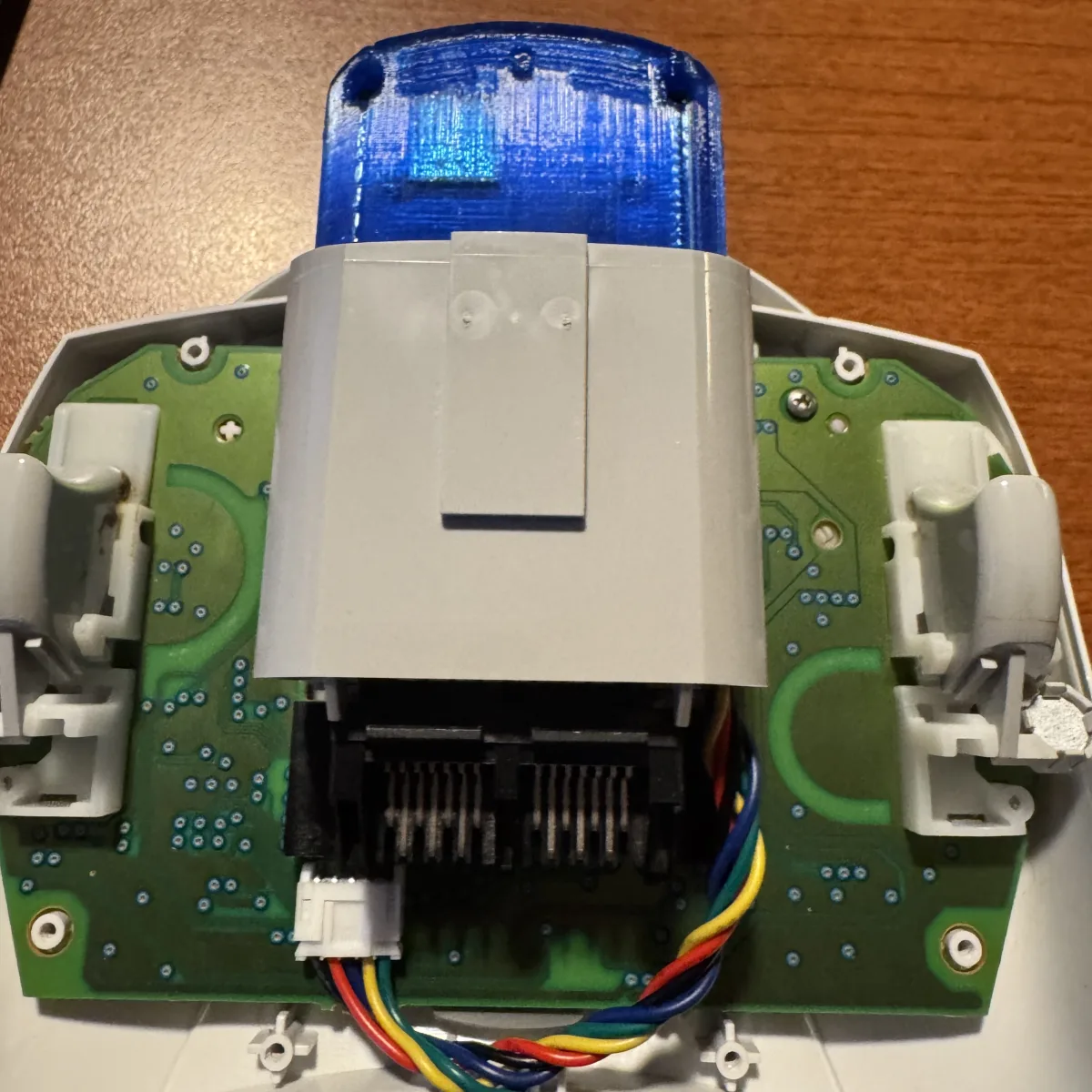 Pulsar seated in the second accessory slot with its cable routed inside the controller