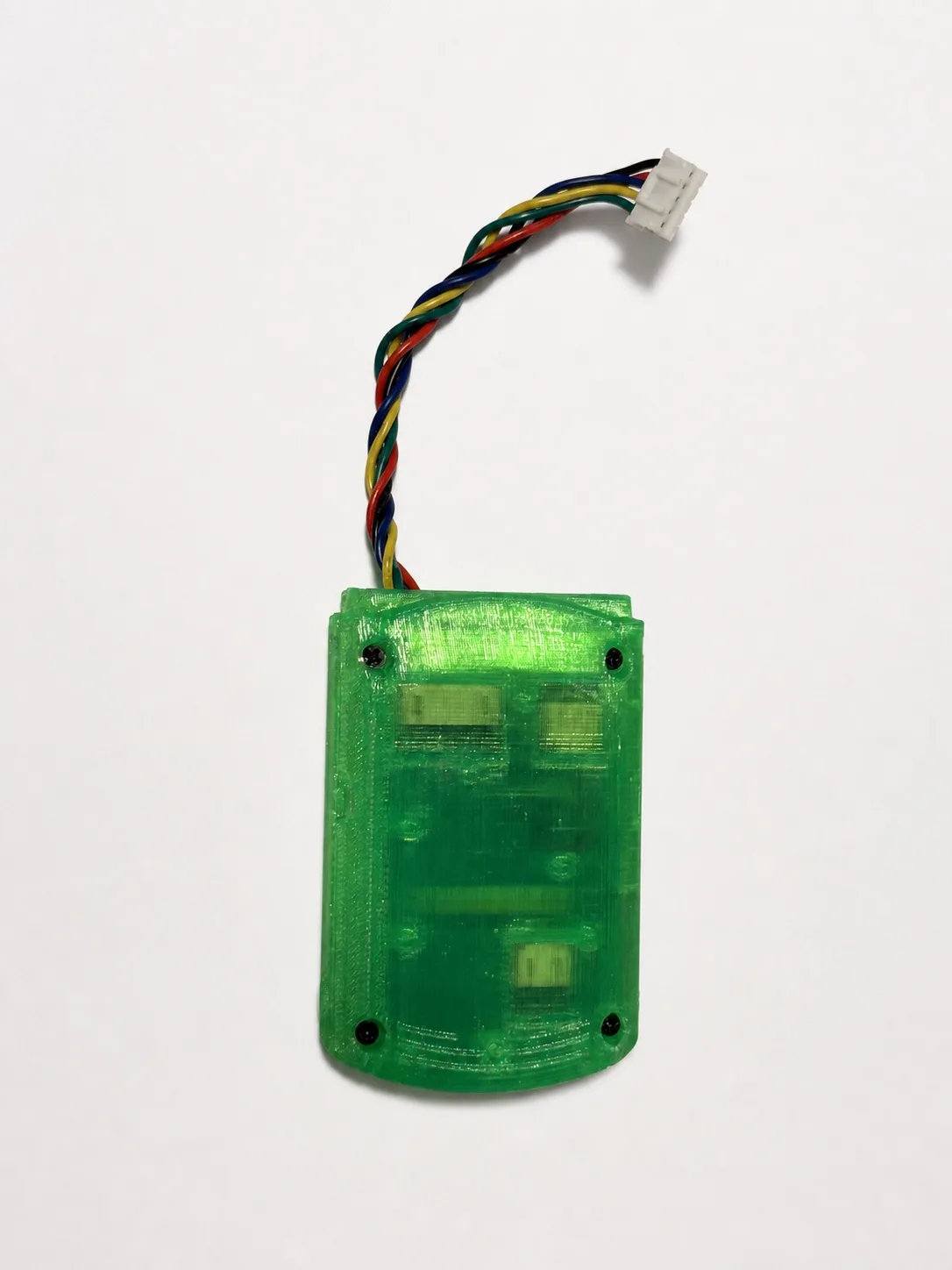 The Pulsar adapter in its translucent printed shell, controller harness attached