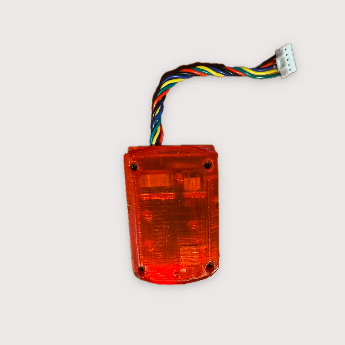 Pulsar in a translucent red printed case, controller harness attached